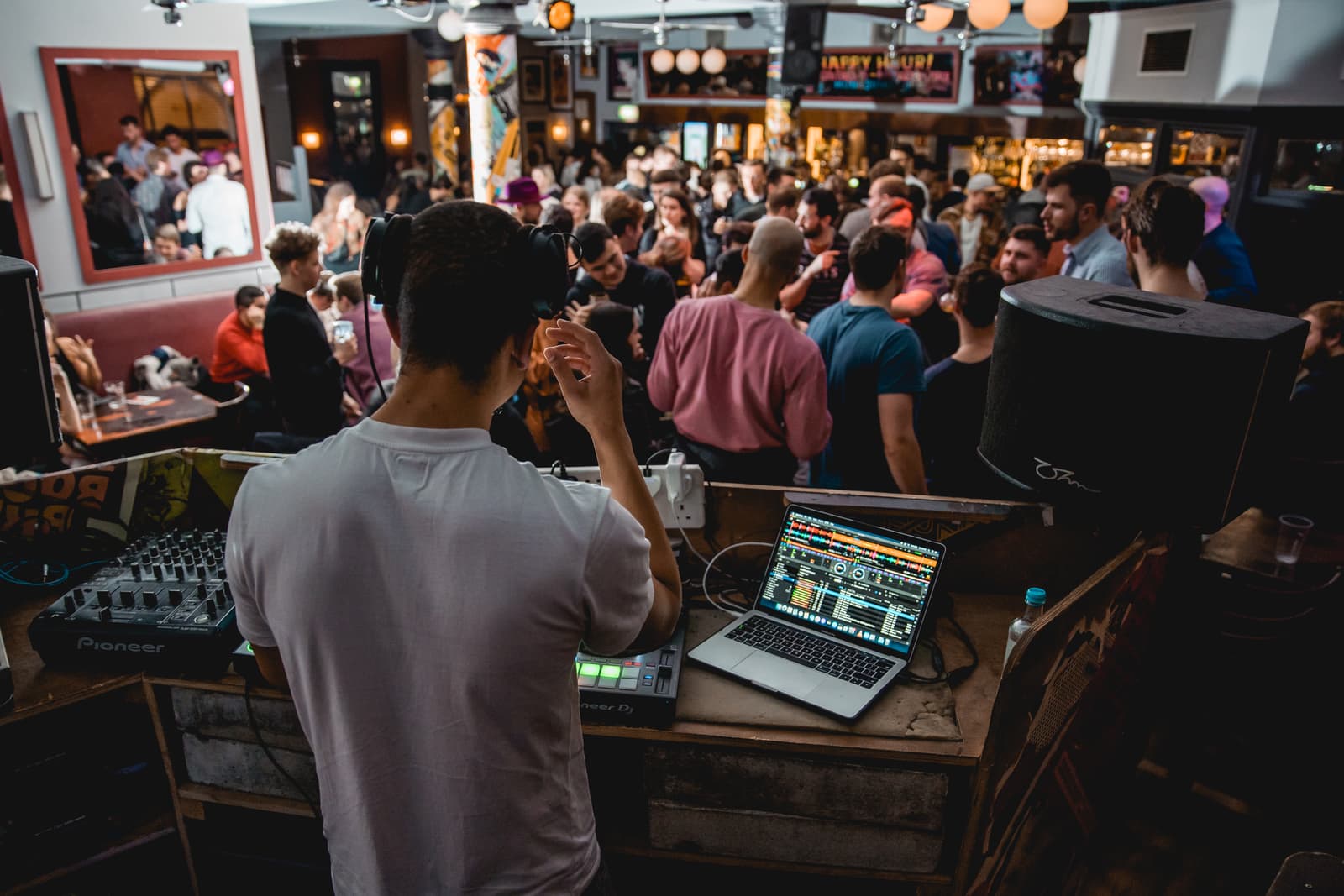 View from behind Austin Ventour's decks over a packed London dancefloor